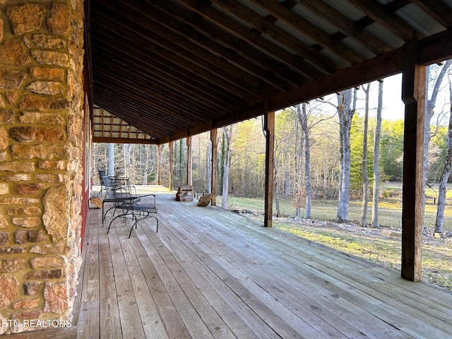 wooden deck featuring a wooded view