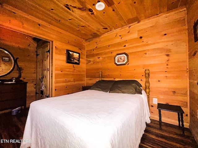 bedroom featuring wood finished floors, wood ceiling, and wood walls