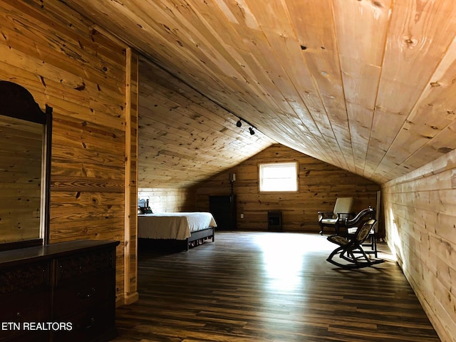 unfurnished bedroom featuring wooden walls, wooden ceiling, lofted ceiling, and wood finished floors