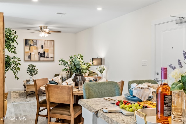 dining room with recessed lighting, a ceiling fan, visible vents, and light wood finished floors