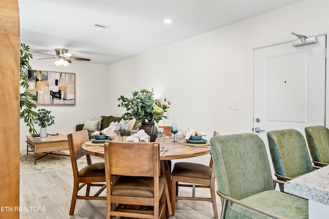 dining space featuring light wood finished floors, visible vents, recessed lighting, and a ceiling fan