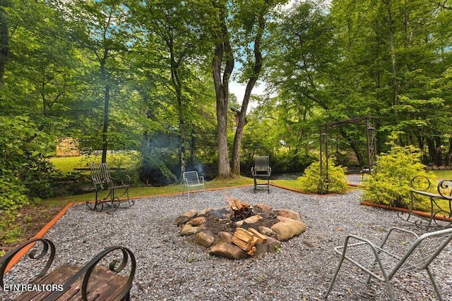 view of property's community featuring a fire pit