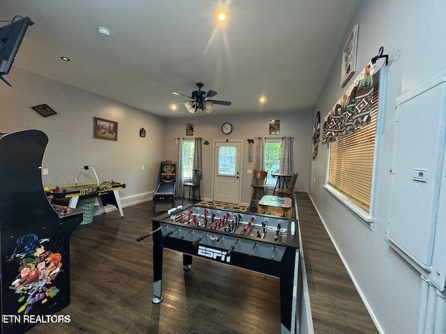 playroom with dark wood-type flooring, baseboards, and a ceiling fan