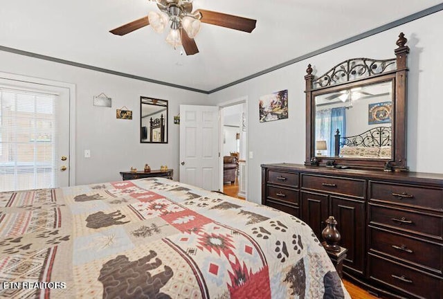 bedroom featuring ceiling fan and crown molding