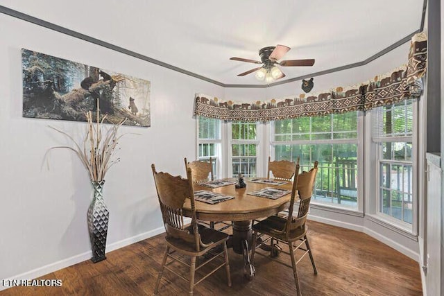 dining area with baseboards, wood finished floors, a ceiling fan, and crown molding