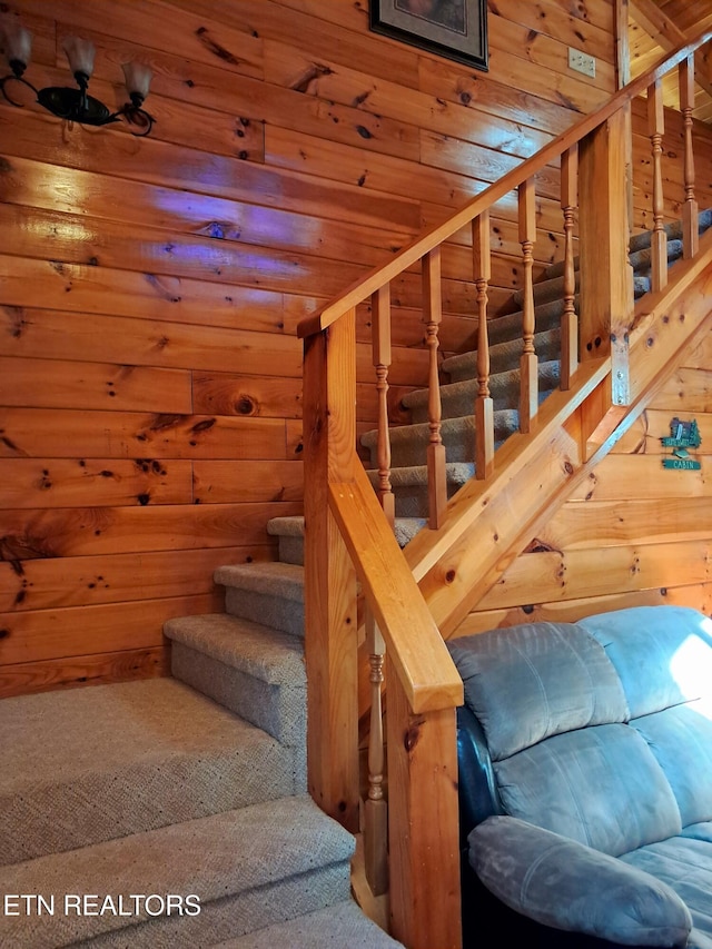 stairway featuring rustic walls