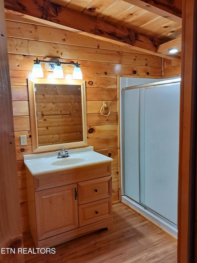 full bath featuring a stall shower and wooden walls