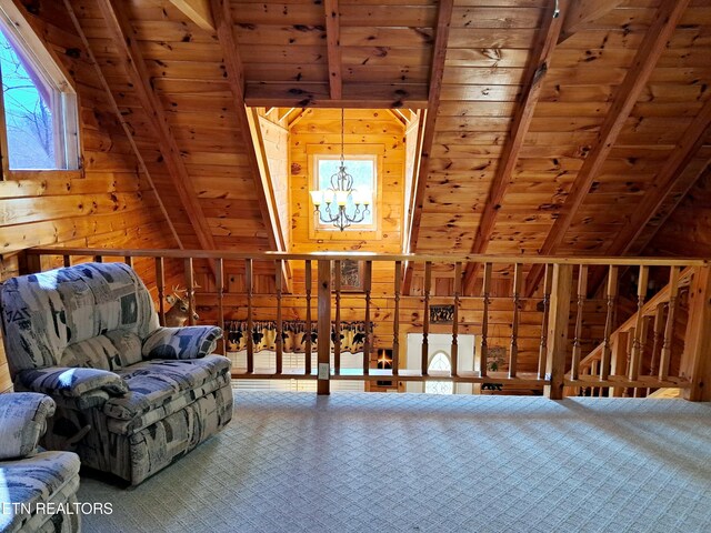 living area featuring a chandelier, wood ceiling, wood walls, and vaulted ceiling with beams