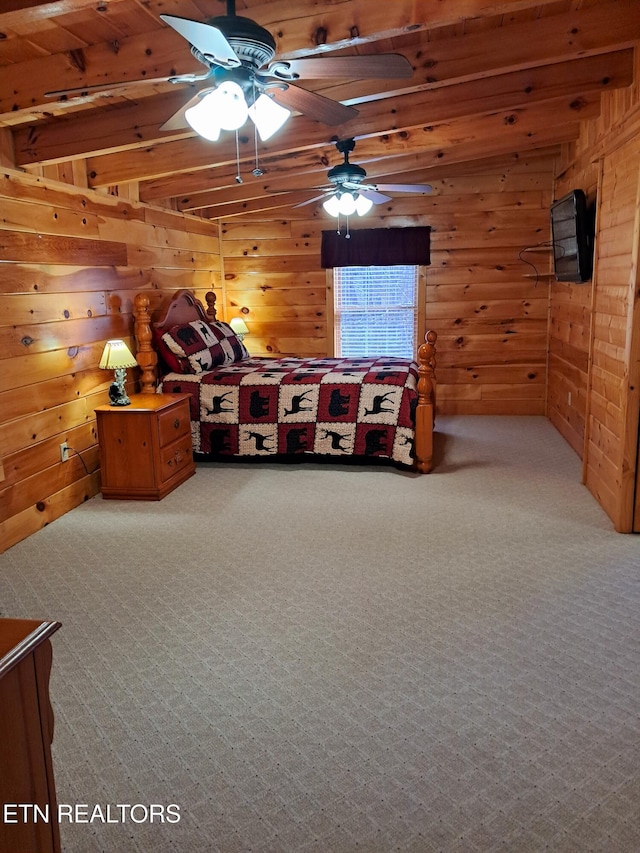 unfurnished bedroom featuring carpet flooring and wooden walls