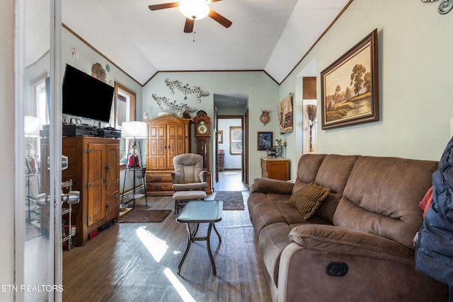 living room with ceiling fan, vaulted ceiling, and wood finished floors