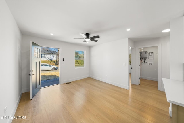 interior space featuring ceiling fan, recessed lighting, visible vents, baseboards, and light wood finished floors