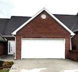 view of front of property with driveway and an attached garage