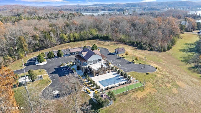 aerial view featuring a water view and a wooded view