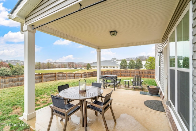 view of patio featuring outdoor dining space and a fenced backyard