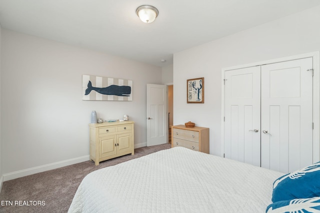 bedroom featuring a closet, carpet flooring, and baseboards