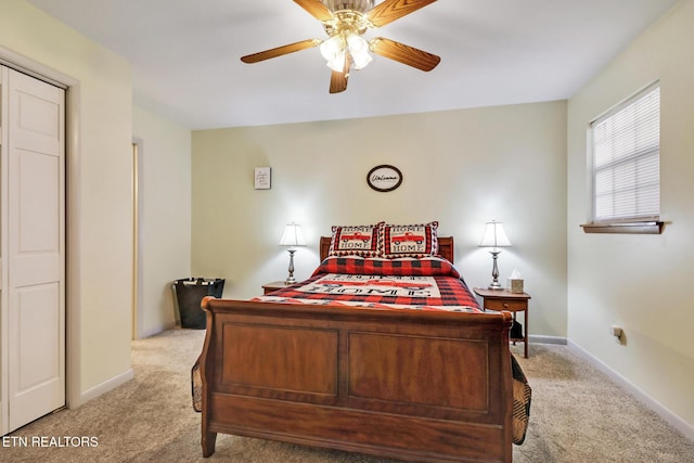 bedroom with ceiling fan, baseboards, and light carpet