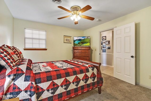 bedroom featuring carpet flooring, baseboards, visible vents, and ceiling fan