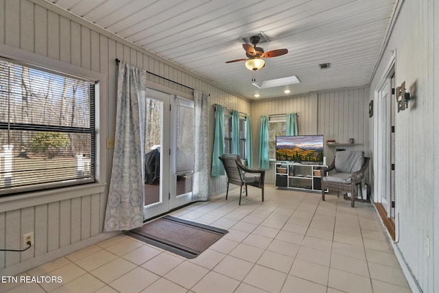 sunroom / solarium with visible vents and a ceiling fan