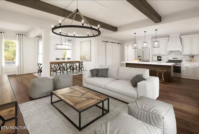 living room featuring dark wood-style floors, beamed ceiling, an inviting chandelier, and a barn door