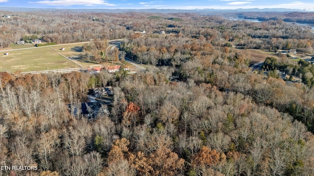 drone / aerial view featuring a forest view