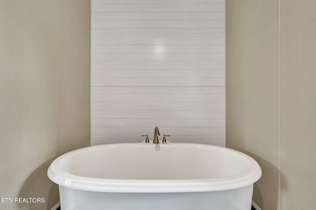 bathroom featuring a soaking tub