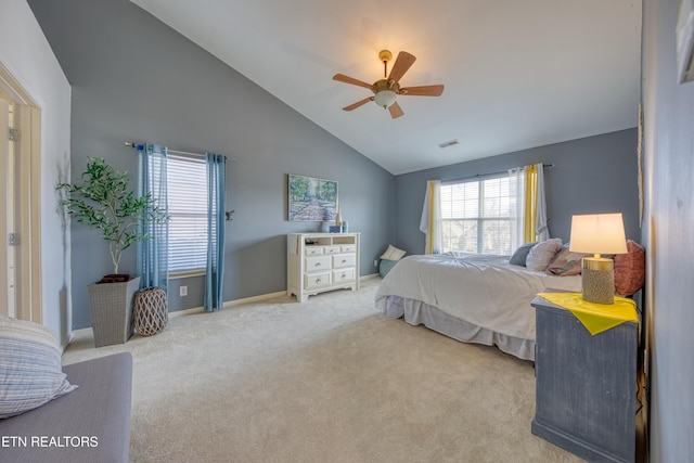 carpeted bedroom with high vaulted ceiling, visible vents, ceiling fan, and baseboards