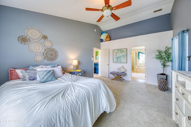 bedroom with light colored carpet, visible vents, connected bathroom, ceiling fan, and high vaulted ceiling