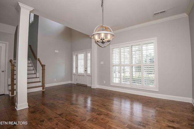 interior space featuring stairs, dark wood-type flooring, visible vents, and an inviting chandelier