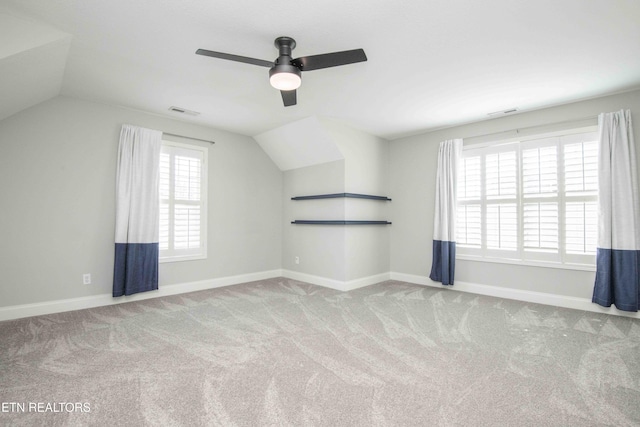 bonus room with lofted ceiling, carpet floors, and baseboards