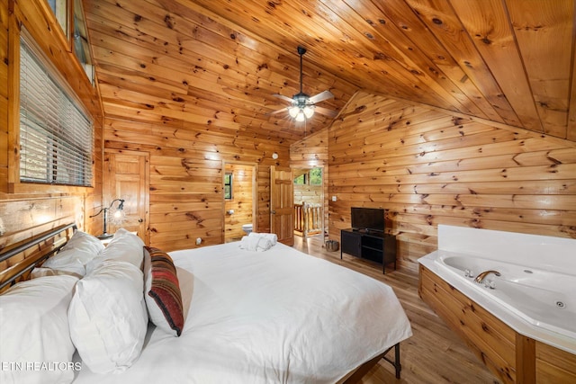 bedroom featuring lofted ceiling, wooden ceiling, wood finished floors, and wood walls