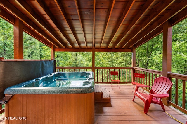 wooden terrace with a hot tub