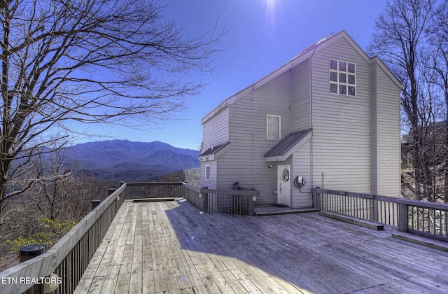 wooden terrace with a mountain view