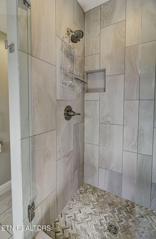 bathroom with a shower stall