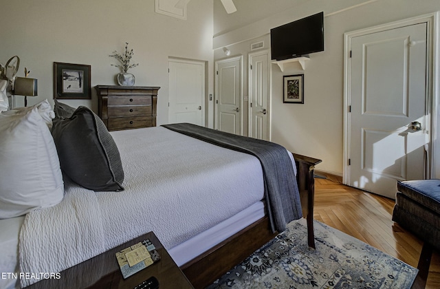 bedroom featuring visible vents and a ceiling fan