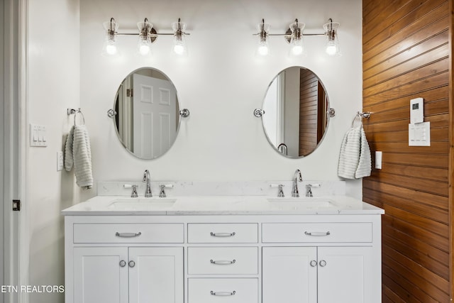 bathroom with double vanity and a sink