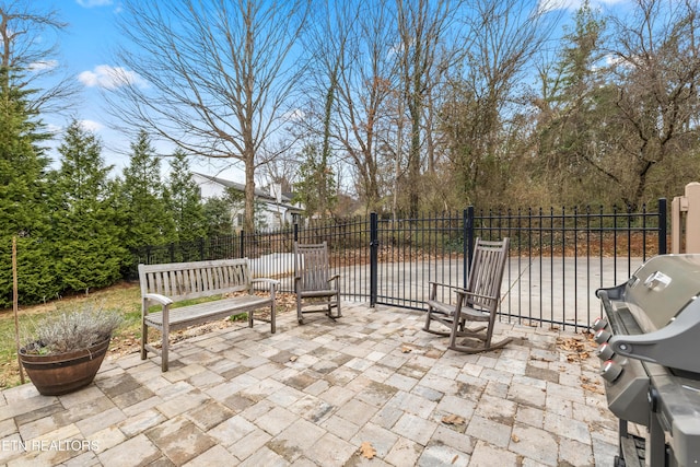 view of patio featuring fence