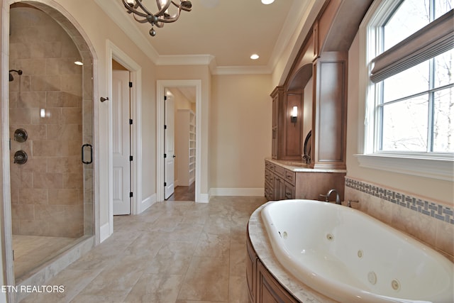 bathroom with vanity, baseboards, ornamental molding, a shower stall, and a jetted tub