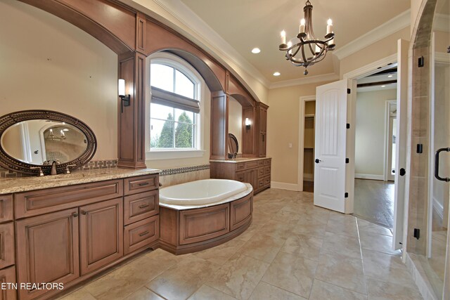 bathroom with two vanities, a stall shower, a sink, crown molding, and a bath