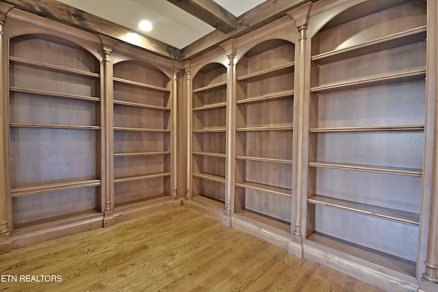 room details with beamed ceiling and wood finished floors