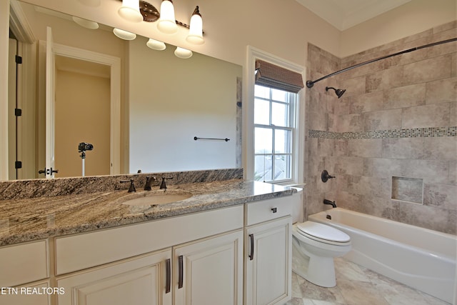 full bathroom with toilet, vanity, and  shower combination