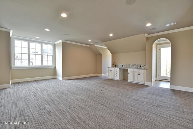 additional living space featuring recessed lighting, visible vents, baseboards, and light colored carpet