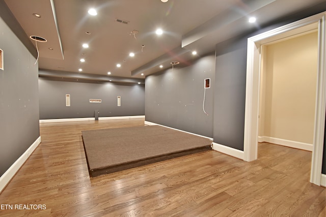 interior space with light wood finished floors, visible vents, recessed lighting, and baseboards