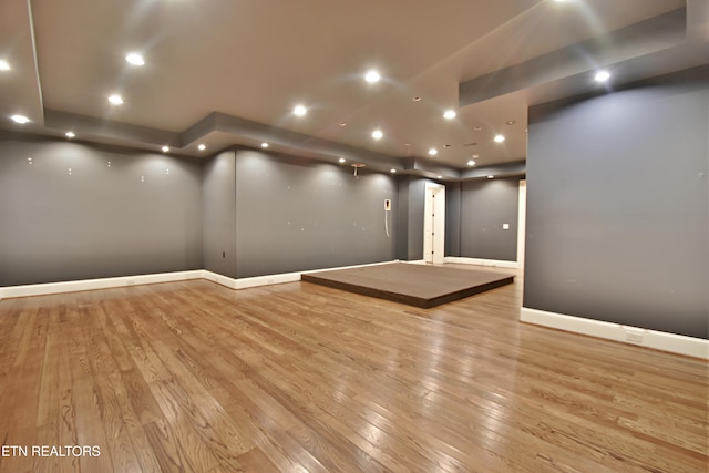 interior space with recessed lighting, baseboards, and wood finished floors