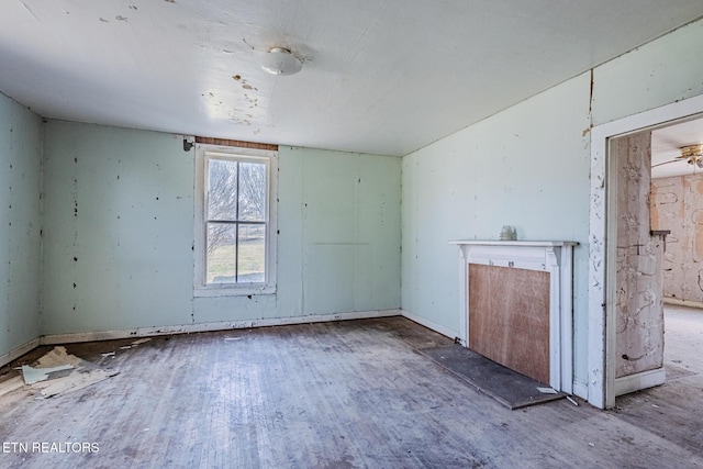 spare room featuring wood finished floors