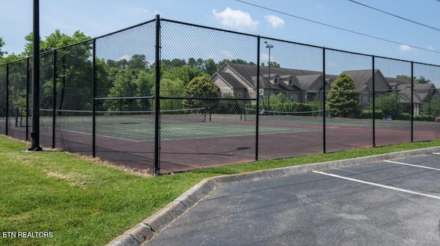 view of tennis court with fence