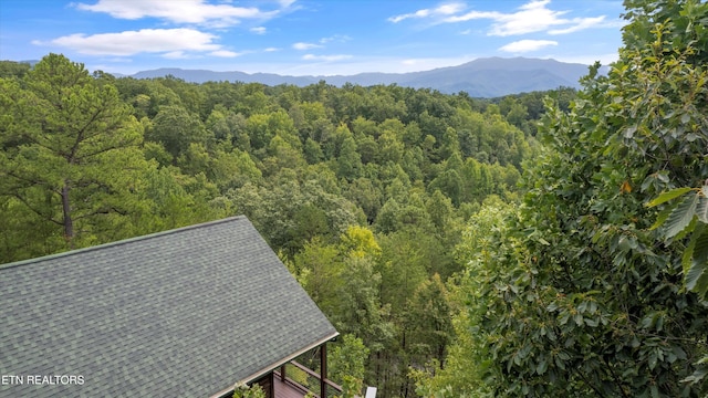 mountain view featuring a view of trees