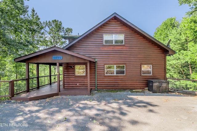 exterior space with faux log siding
