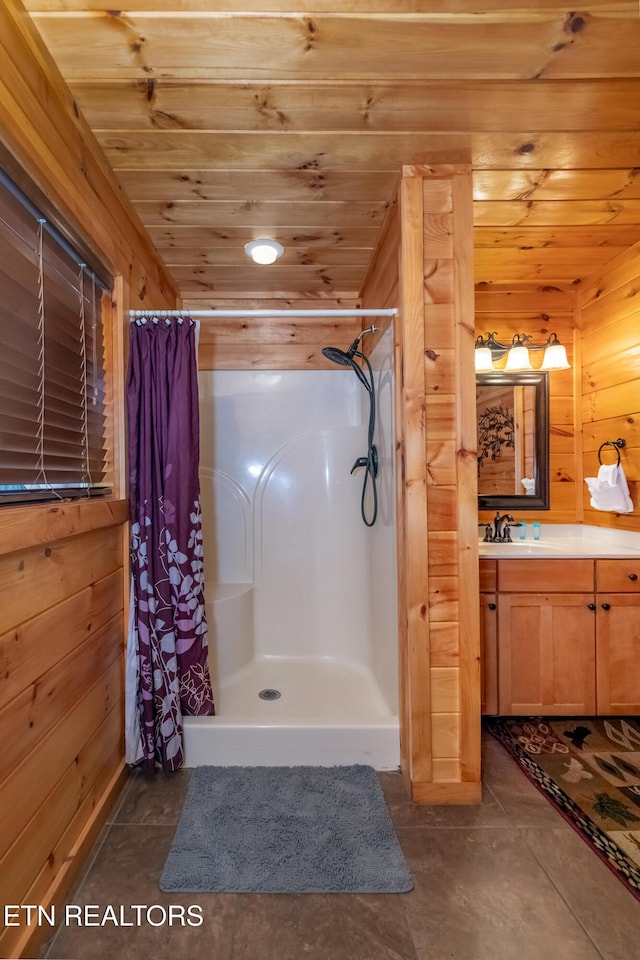 full bathroom featuring curtained shower, wood ceiling, wooden walls, and vanity