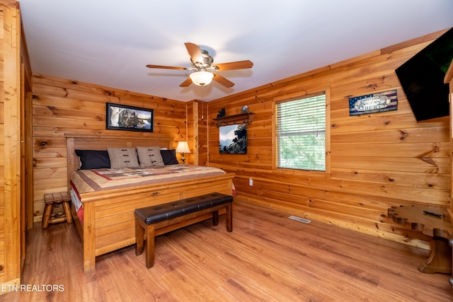 bedroom with light wood-style floors and ceiling fan