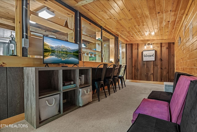 interior space with wood ceiling, wooden walls, and carpet flooring